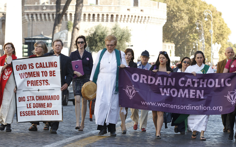 Roy Bourgeois, third from left, marches down Via della Conciliazione toward the Vatican during a demonstration in Rome Oct. 17, 2011.  (CNS/Paul Haring)