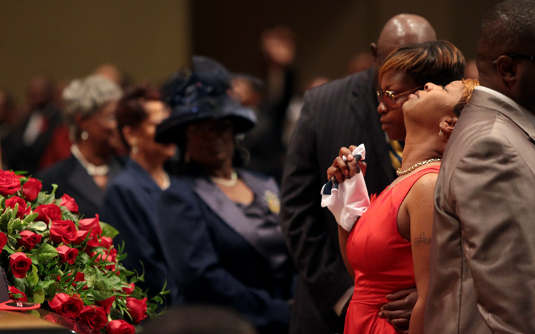 Lesley McSpadden is comforted during the Aug. 25 funeral service for her son, Michael Brown, inside Friendly Temple Missionary Baptist Church in St. Louis. (CNS/EPA/Robert Cohen, pool)
