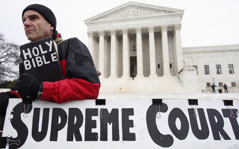 Alan Hoyle rallies in front of the U.S. Supreme Court on Wednesday in Washington. (CNS/Reuters/Yuri Gripas)