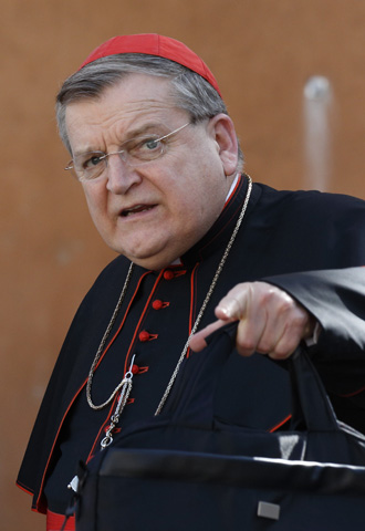 Cardinal Raymond Burke leaves an Oct. 9 session of the extraordinary Synod of Bishops on the family at the Vatican. (CNS/Paul Haring)