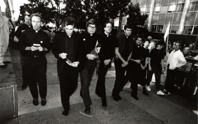 Jesuit priests march outside the Federal Building in San Francisco Nov. 20, 1989, to protest the killing of six Jesuit priests and two women four days earlier in El Salvador. More than 300 people joined the demonstration. (CNS/The Catholic Voice/Chris Duffey)