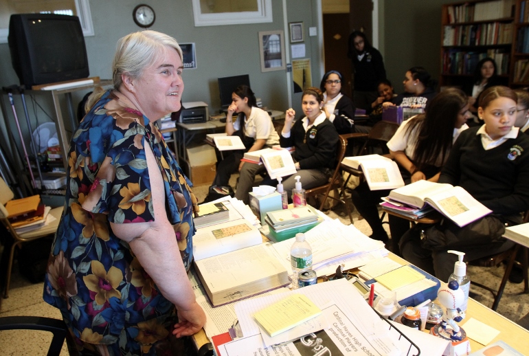 Ellen Clancy, a teacher at Mother Cabrini High School in the Washington Heights section of New York City since 1972, prepares to lead an English Literature class April 1. The all-girls college preparatory school, founded in 1899 by St. Frances Xavier Cabrini, will close at the end of the academic year because of declining enrollment and increasing operating costs. (CNS photo/Gregory A. Shemitz)