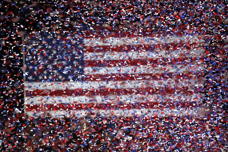 Confetti rains in front of a U.S. flag in Chicago in this Nov. 3, 2012, file photo. (CNS photo/Kamil Krzaczynski, EPA)