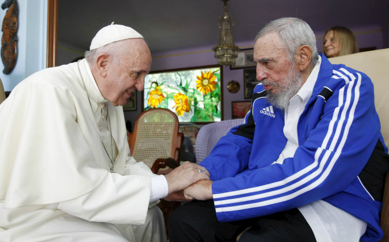 Pope Francis and former Cuban President Fidel Castro grasp each other's hands at Castro's residence in Havana Sept. 20, 2015. (CNS photo/Alex Castro, AIN handout via Reuters)