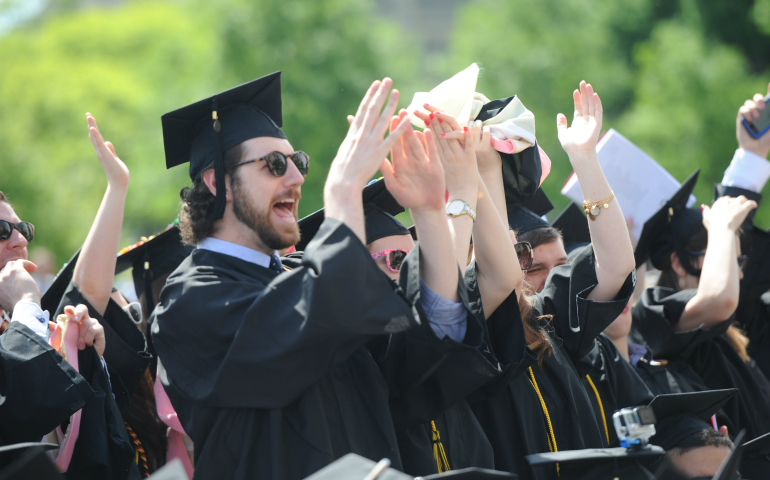 Graduates celebrate during The Catholic University of America's 127th annual commencement May 2016 outside the Basilica of the National Shrine of the Immaculate Conception in Washington. (CNS/Dana Rene Bowler, CUA) 