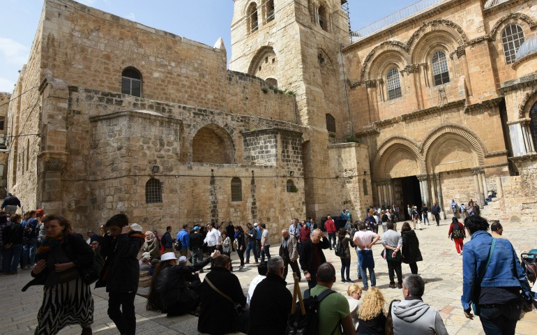 Tourists are seen outside the Church of the Holy Sepulcher March 23 in Jerusalem. U.S. President Donald Trump is expected to visit the site after the Western Wall. (CNS/Debbie Hill)