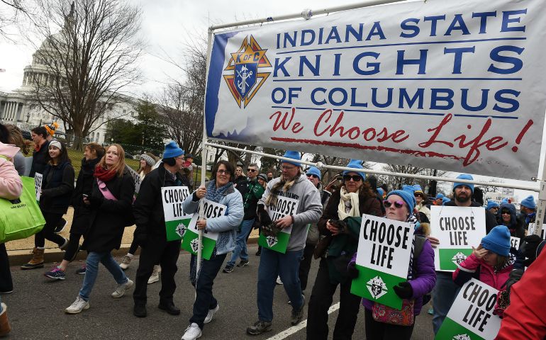 Pro-life advocates with the Indiana State Knights of Columbus carry a banner past the U.S. Supreme Court Jan. 27 during the annual March for Life in Washington. (CNS photo/Leslie E. Kossoff) 