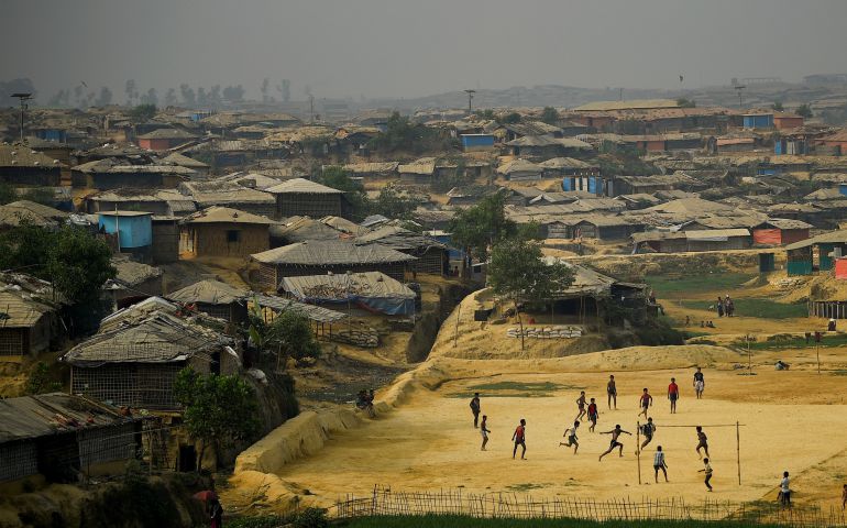 Rohingya refugees play football at a refugee camp in Cox's Bazaar, Bangladesh, March 27. (CNS/Reuters/Clodagh Kilcoyne)