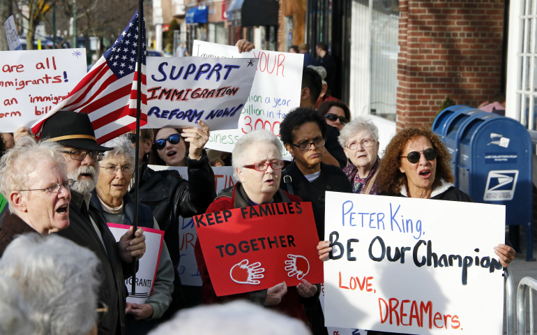 People gather at a rally in support of immigrants in Massapequa Park, N.Y., Feb. 24. The demonstration was held outside Republican Rep. Peter King's district office in an effort to urge the congressman to help protect unauthorized immigrants who currently have reprieve from deportation under the Deferred Action for Childhood Arrivals program, known as DACA. (CNS photo/Gregory A. Shemitz)