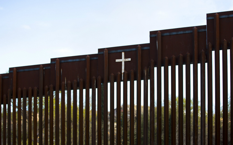 The bollard steel border fence splits the U.S. from Mexico in this view west of central Nogales, Ariz., Feb. 19. (CNS photo/Nancy Wiechec)