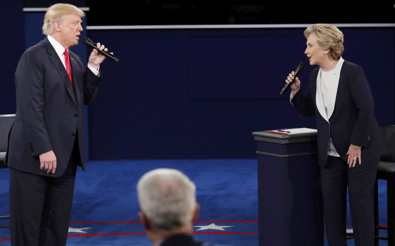 Republican U.S. presidential nominee Donald Trump, left, and Democratic presidential nominee Hillary Clinton speak during their Oct. 9 presidential town hall debate at Washington University in St. Louis. (CNS photo/Jim Young, Reuters)