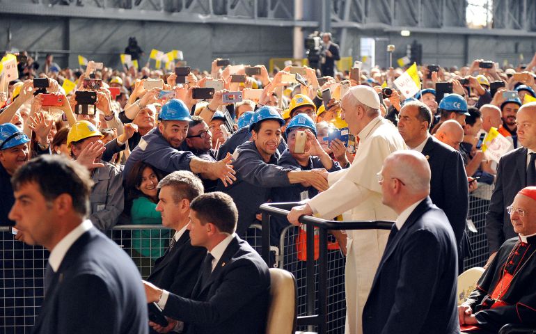 Pope Francis greets workers as he arrives at the ILVA steel plant during his May 27 pastoral visit in Genoa, Italy. (CNS photo/Giorgio Perottino, Reuters)