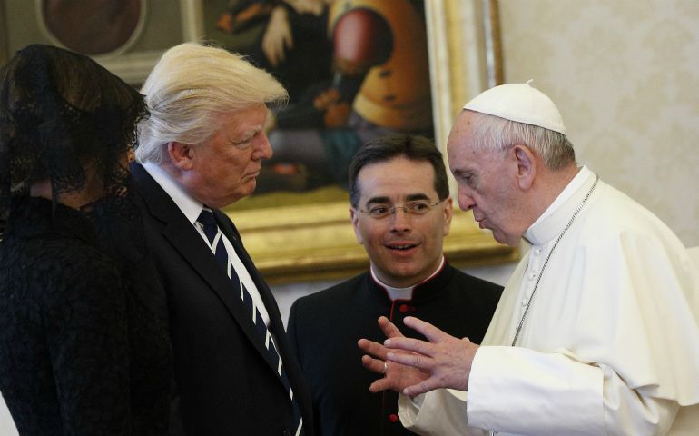 Pope Francis talks with U.S. President Donald Trump, accompanied by his wife, Melania, left, during a private audience at the Vatican May 24. (CNS photo/Paul Haring)