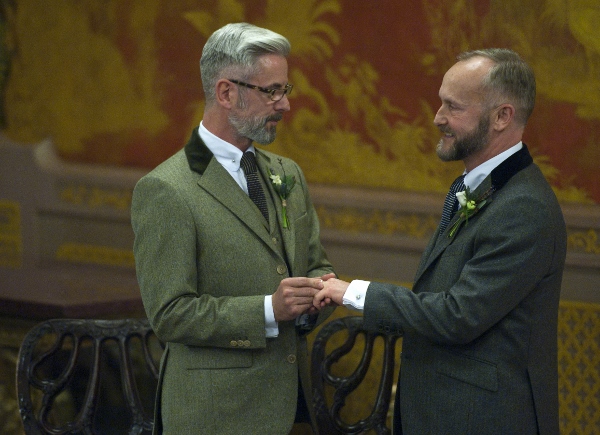 Two men exchange rings during their marriage ceremony in 2014 in Brighton, England. In his postsynodal apostolic exhortation on the family, "Amoris Laetitia" ("The Joy of Love"), released April 8, Pope Francis repeated his and the synod's insistence that the church cannot consider same-sex unions to be a marriage, but also insisted, "every person, regardless of sexual orientation, ought to be respected in his or her dignity." (CNS photo/Will Oliver, EPA)