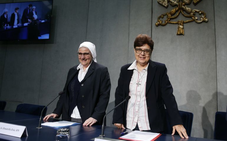 Sr. Donatella Zoia, superior of the Sisters of the Precious Blood, and Sr. Carmen Sammut, superior of the Missionary Sisters of Our Lady of Africa and president of the International Union of Superiors General, arrive for a news conference at the Vatican May 2. Pope Francis is scheduled to meet May 10 with the heads of more than 800 women's religious orders who are in Rome for plenary meetings. (CNS/Paul Haring)