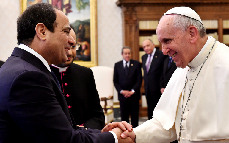 Pope Francis and Egypt's President Abdel Fattah al-Sisi shake hands during a private audience in 2014 at the Vatican. Accepting an invitation from Egypt's president and top religious leaders, Pope Francis will visit Cairo April 28-29. (CNS photo/Gabriel Bouys pool, via Reuters) 