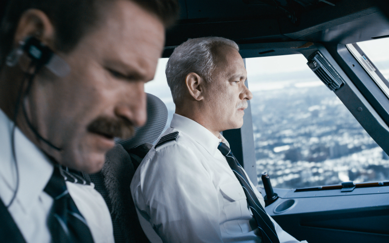 Arron Eckhart and Tom Hanks star in a scene from the movie "Sully." (CNS photo/Warner Bros.)