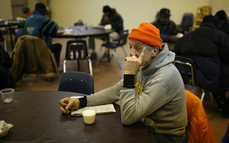 A man finishes a meal at Detroit's Capuchin Soup Kitchen, where hundreds of people receive free meals and groceries, in 2008. (CNS/Reuters/Carlos Barria)