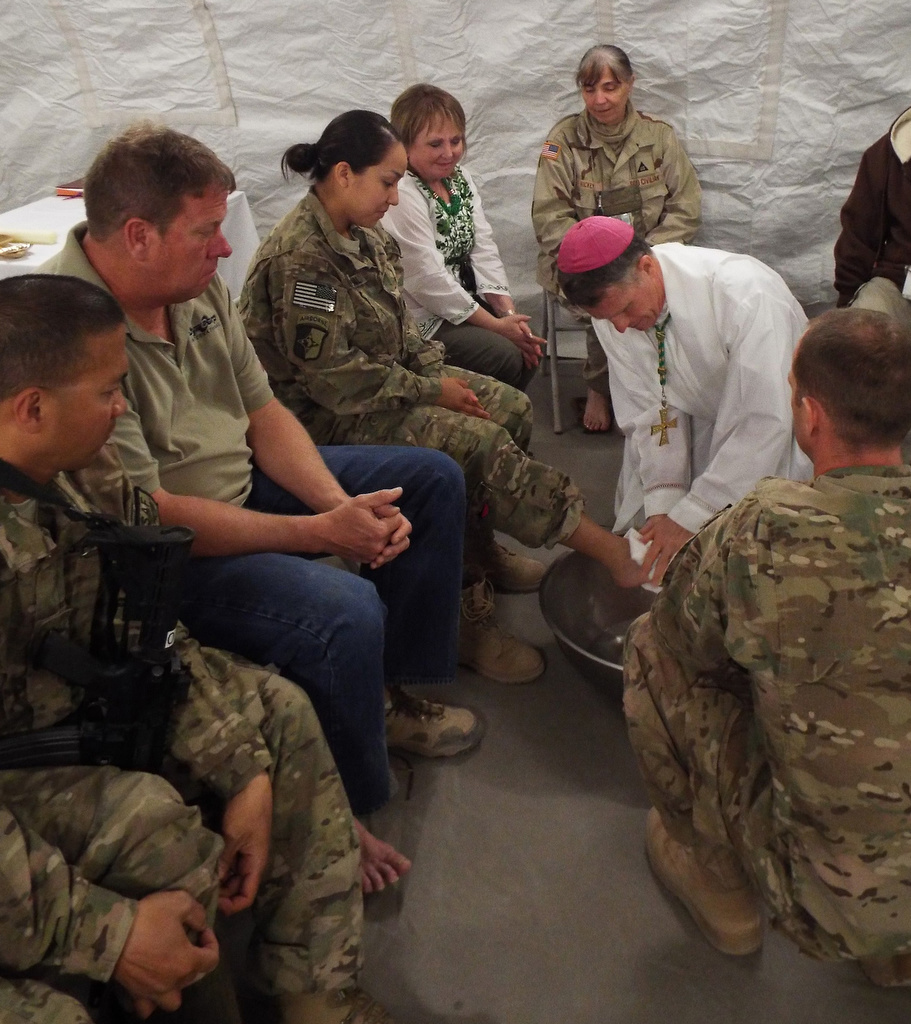 Archbishop Timothy Broglio of the U.S. Archdiocese for the Military Services washes the feet of a U.S. soldier in 2014 on Holy Thursday in Afghanistan at Shindand Air Base, located in Herat province. (CNS/Courtesy of the Archdiocese for the U.S . Military Services) 