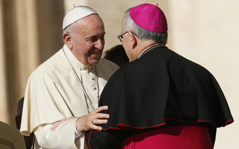 Pope Francis talks with Archbishop Charles Chaput of Philadelphia during his Nov. 19 general audience in St. Peter's Square at the Vatican. (CNS/Paul Haring)
