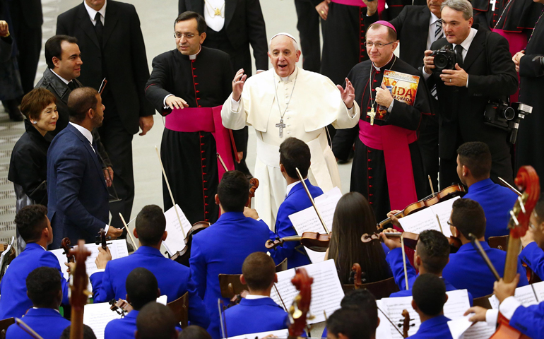 Pope Francis talks to members of an orchestra during a special audience with members of the Catholic Fraternity of Charismatic Covenant Communities and Fellowships on Friday at the Vatican. (CNS/Reuters/Tony Gentile)