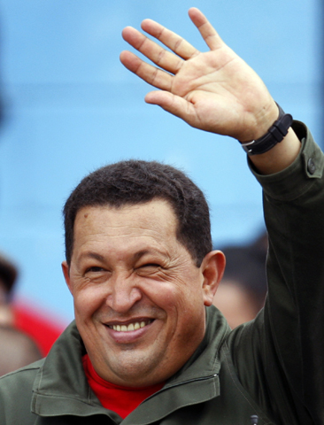 President Hugo Chavez waves to supporters after casting his vote in Venezuela's 2008 election. (CNS/Reuters) 