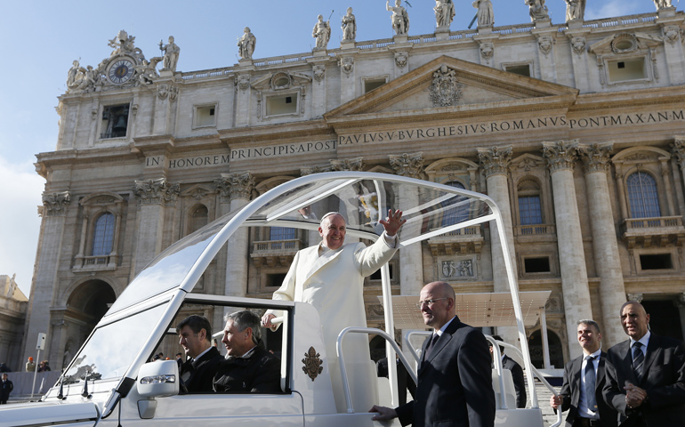 Pope Francis greets the crowd Jan. 15 as he leaves his general audience in St. Peter's Square at the Vatican. (CNS/Paul Haring)