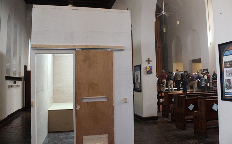 A replica of a solitary confinement cell stands in the sanctuary of St. Stephen and the Incarnation Episcopal Church in Washington, D.C., on March 22. The National Religious Campaign Against Torture placed it there to build awareness about solitary confinement. (RNS/Adelle M. Banks)