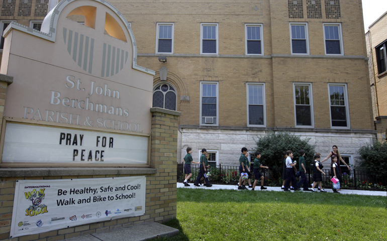 Third-graders at St. John Berchmans School in Chicago walk outside Sept. 6, 2013. Catholic schools in the Chicago archdiocese are implementing the Common Core State Standards.