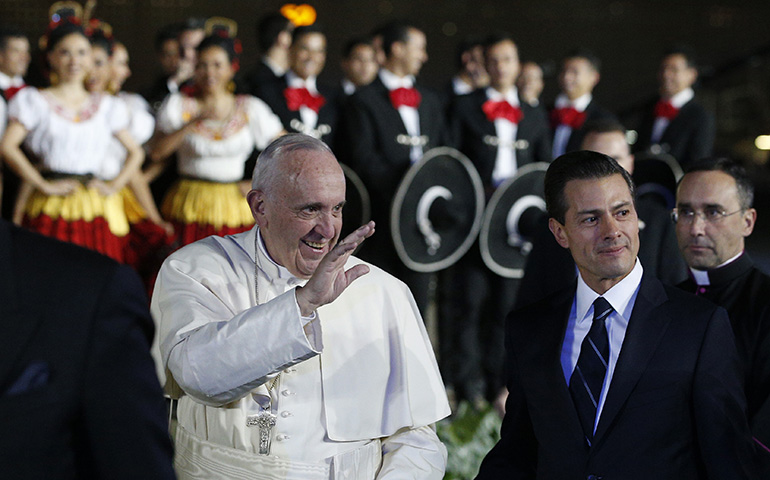 Pope Francis walks with Mexican President Enrique Pena Nieto at Benito Juarez International Airport in Mexico City Feb. 12. (CNS/Paul Haring)