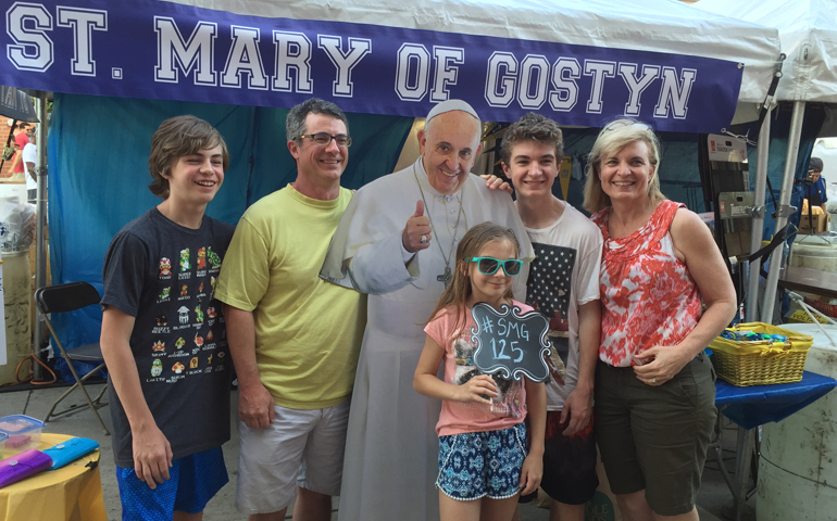 The Crowe family, pictured with St. Mary of Gostyn Parish's photographic Pope Francis cutout