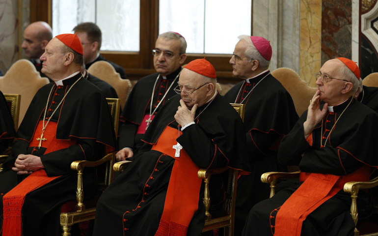 From left: Cardinals Gianfranco, Ravasi, Elio Sgreccia and Fernando Filoni listen to Pope Francis give his Christmas message to members of the Roman Curia on Monday in Clementine Hall at the Vatican. (CNS/Paul Haring)