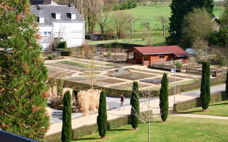 A visitor walks through the gardens at Kloster Arenberg in Koblenz, Germany. (Georgia Perry)