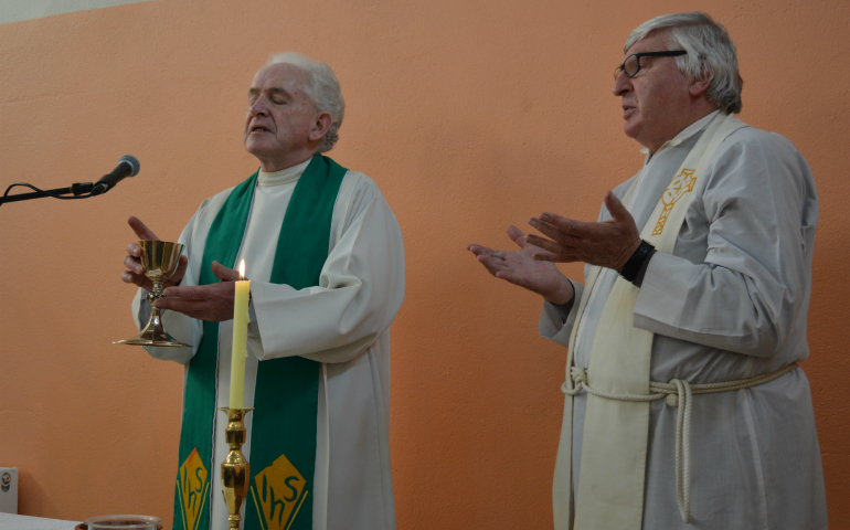 Redemptorist Fr. Tony Flannery, left, concelebrates Mass with Fr. Willie Cummins from County Clare. (NCR/Sarah Mac Donald)