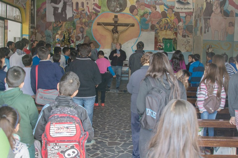 A youth group from the Virgin of Caacupé Parish in Buenos Aires, Argentina, gathers before Fr. Lorenzo "Toto" de Vedia Sept. 5. (Horacio "Tati" di Renzi) 