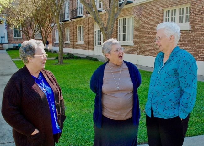 From left: Most Holy Sacrament Sr. Micha DeHart, Marianites of Holy Cross Sr. Ann Lacour and Most Holy Sacrament Sr. Diane Dornan view the grounds at Holy Angels Convent in New Orleans. (GSR photo/Dan Stockman)