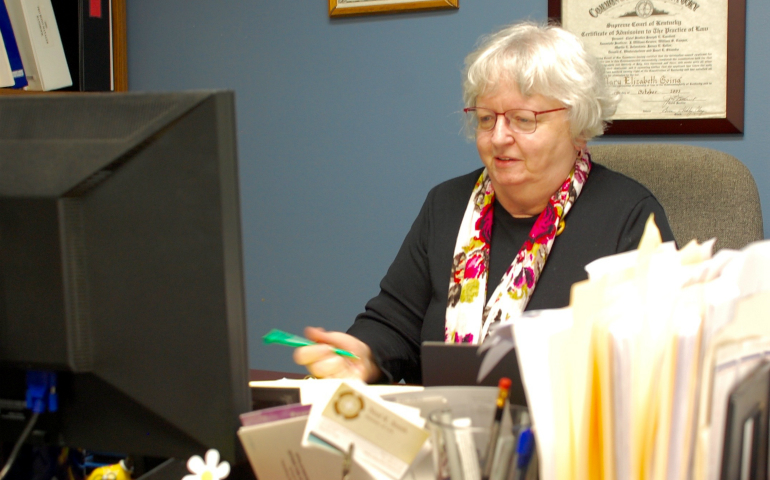 Mount Tabor Benedictine Sr. Mary Going works on a case at the Appalachian Research & Defense Fund of Kentucky in Prestonsburg, Kentucky, where she is an attorney. (GSR photo/Dan Stockman) 