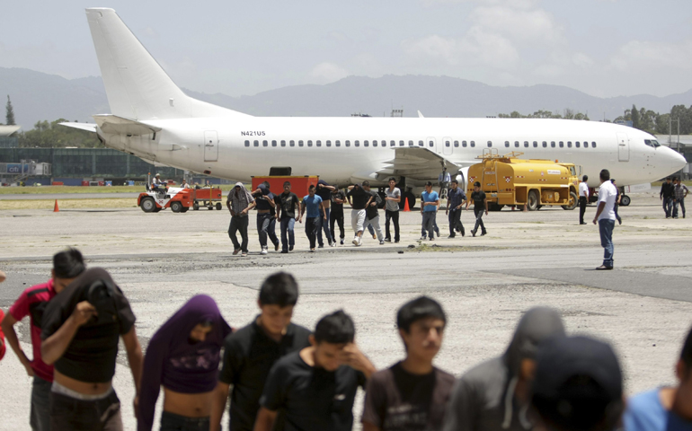Migrants from Guatemala deported from the U.S. arrive at La Aurora International Airport in Guatemala City on Thursday. (CNS/Reuters/Pakal Koban)