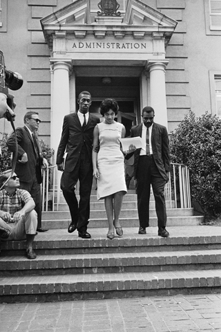 From left: Robert Anderson, Henrie Monteith and James Solomon leave the University of South Carolina administration building in Columbia after registering Sept. 11, 1963.
