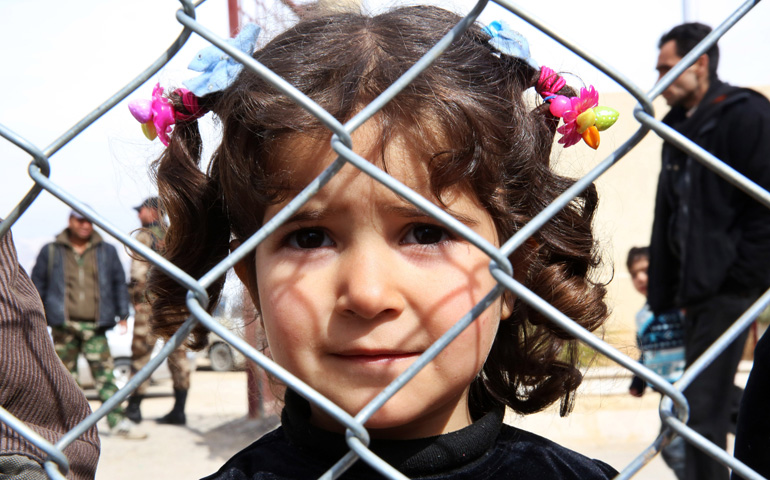 A displaced Syrian girl finds temporary shelter at a school in Damascus, Syria, Feb. 23. (CNS/EPA/Youssef Badawi) 