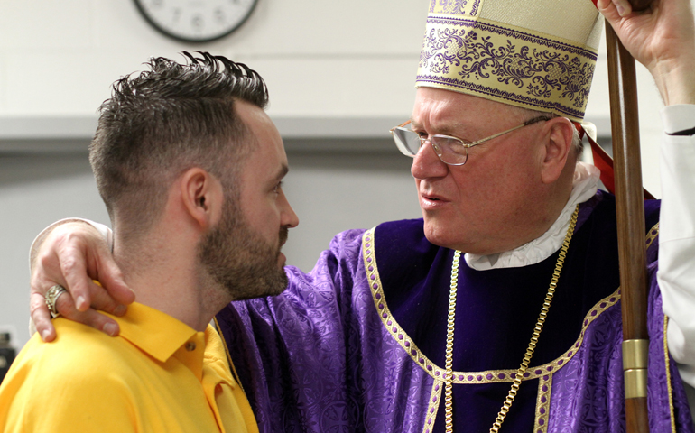 Cardinal Timothy Dolan of New York speaks with inmate Gary McGurk after celebrating Mass Monday for inmates and staff at Sullivan Correctional Facility, a New York state maximum-security prison in Fallsburg, N.Y. (CNS/Gregory A. Shemitz) 
