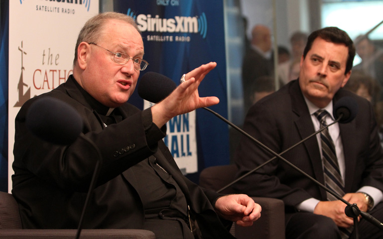 New York Cardinal Timothy Dolan is seen participating in a satellite radio broadcast in New York May 8. (CNS photo/Gregory A. Shemitz)