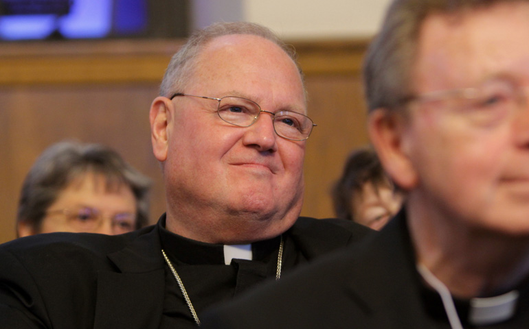 Cardinal Timothy Dolan of New York listens to a presentation during a gathering of New York state's bishops and catechetical leaders in September. (CNS/Gregory A. Shemitz)