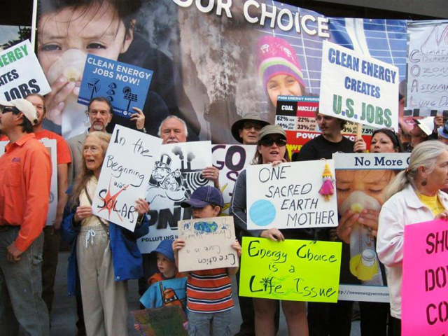 New Mexico Interfaith Power and Light hosts a rally in front of the Public Utilities of New Mexico office building in the spring to encourage the company to increase solar energy and decrease coal use.