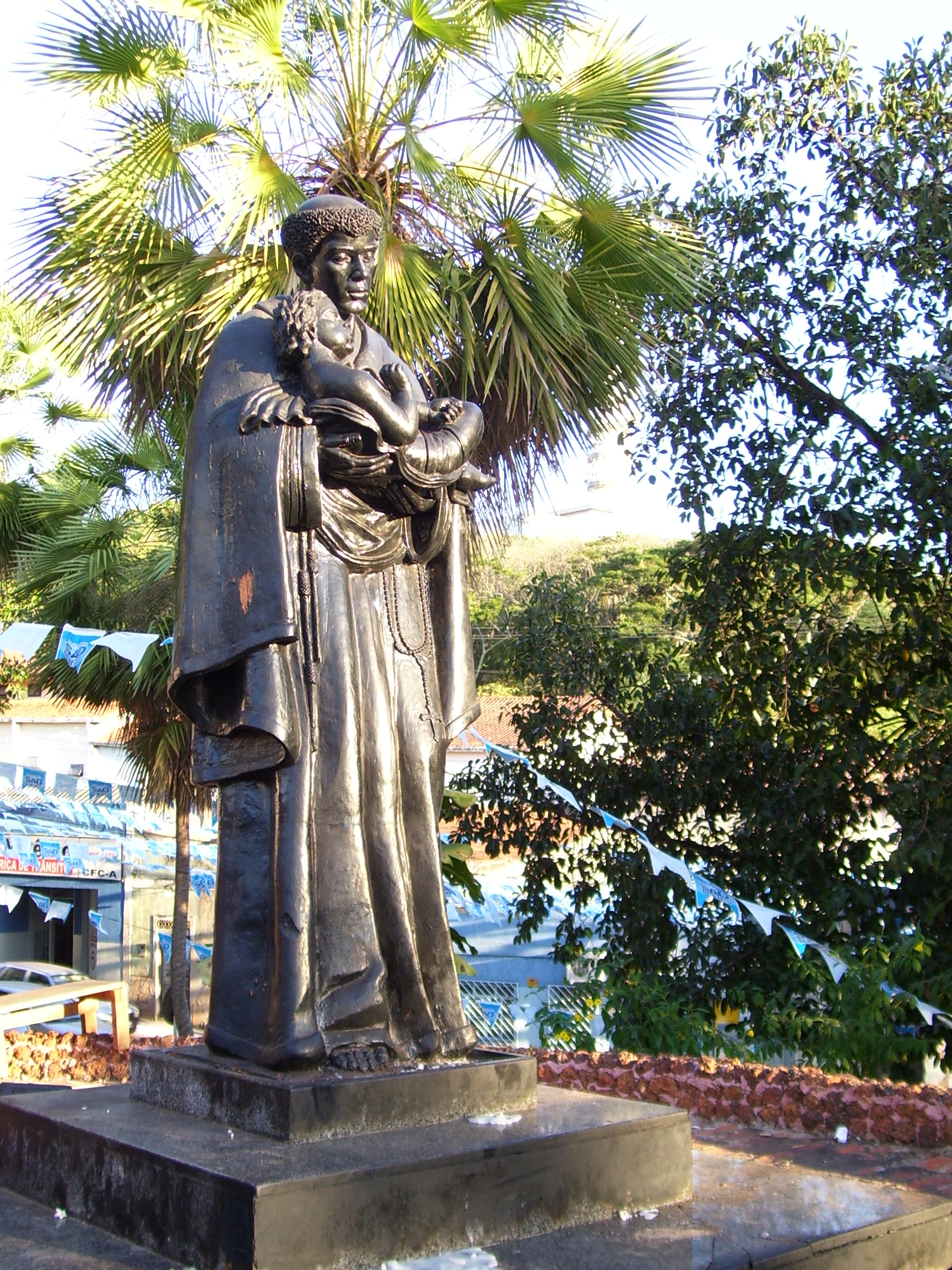  Statue of Saint Benedict the Moor, in the front of the Church of Our Lady of the Rosary and Saint Benedict, Cuiabá, Mato Grosso, Brazil.  [Public domain], via Wikimedia Commons
