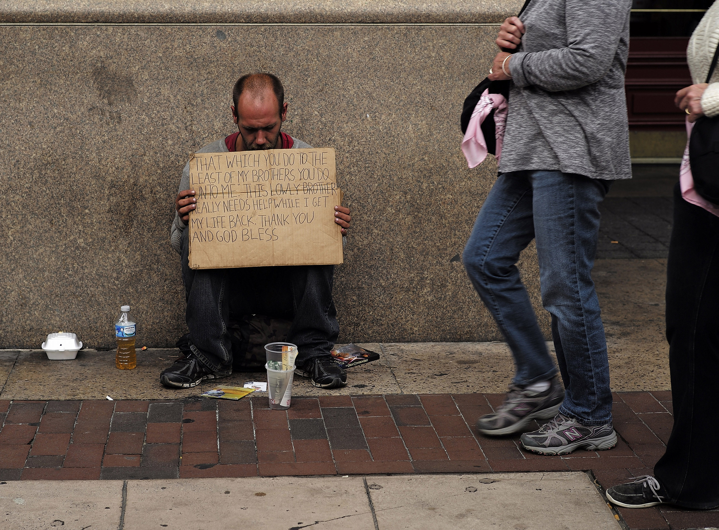 A homeless man sits on a sidewalk in Philadelphia Sept. 26, 2015. (CNS/CJ Gunther, EPA)
