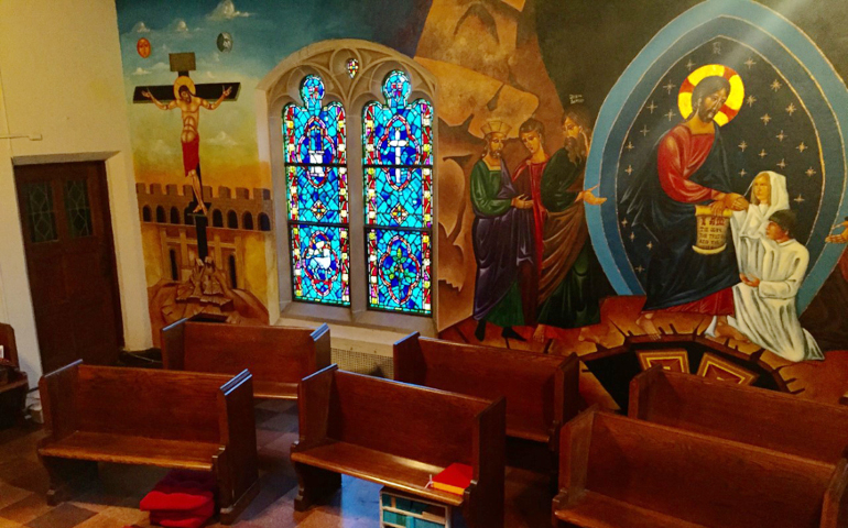 The back wall of the Chapel of Our Lady of Consolation features iconography of the Crucifixion and Resurrection. (Trinity Icons)