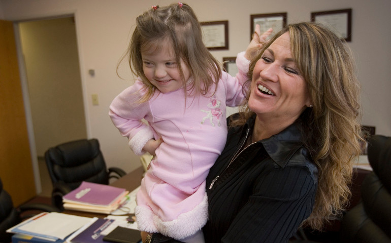 Nancy Gianni, right, and daughter GiGi, then 4 years old, play as they visit the doctor's office in January 2007 in Hoffman Estates, Illinois. (Newscom/MCT/John Dziekan)