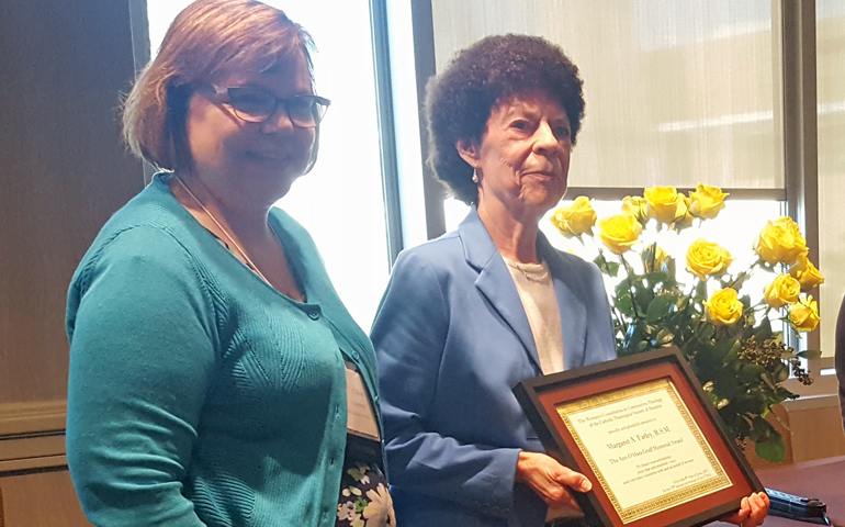 Margaret Farley receives the Ann O'Hara Graff Award from Colleen Carpenter at the CTSA convention in Albuquerque. (Heidi Schlumpf)