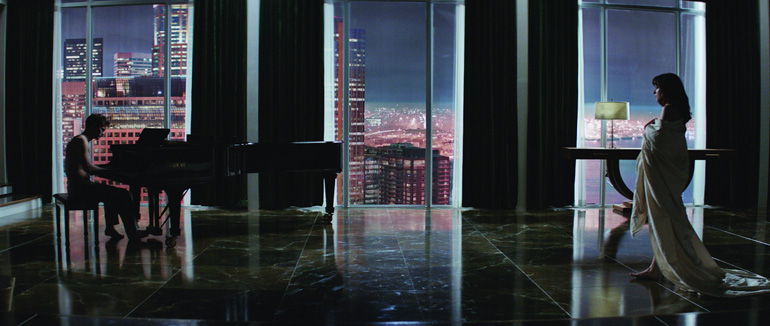 Jamie Dornan and Dakota Johnson star in "Fifty Shades of Grey." (CNS/Universal Pictures and Focus Features) 
